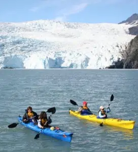 Sea Kayakers near a Glacier
