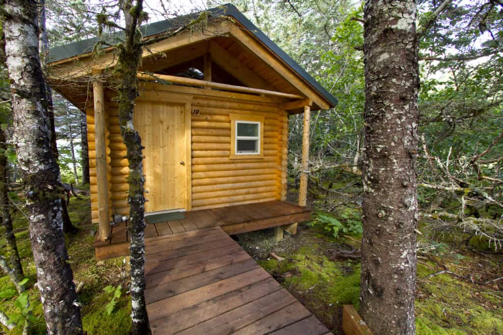 The front of cabin #10 at Kenai Fjords Glacier Lodge showing a small part of the boardwalk