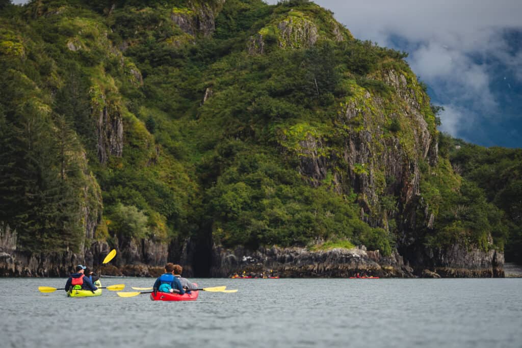 Two kayakers near an island in Kenai Fjords National Park