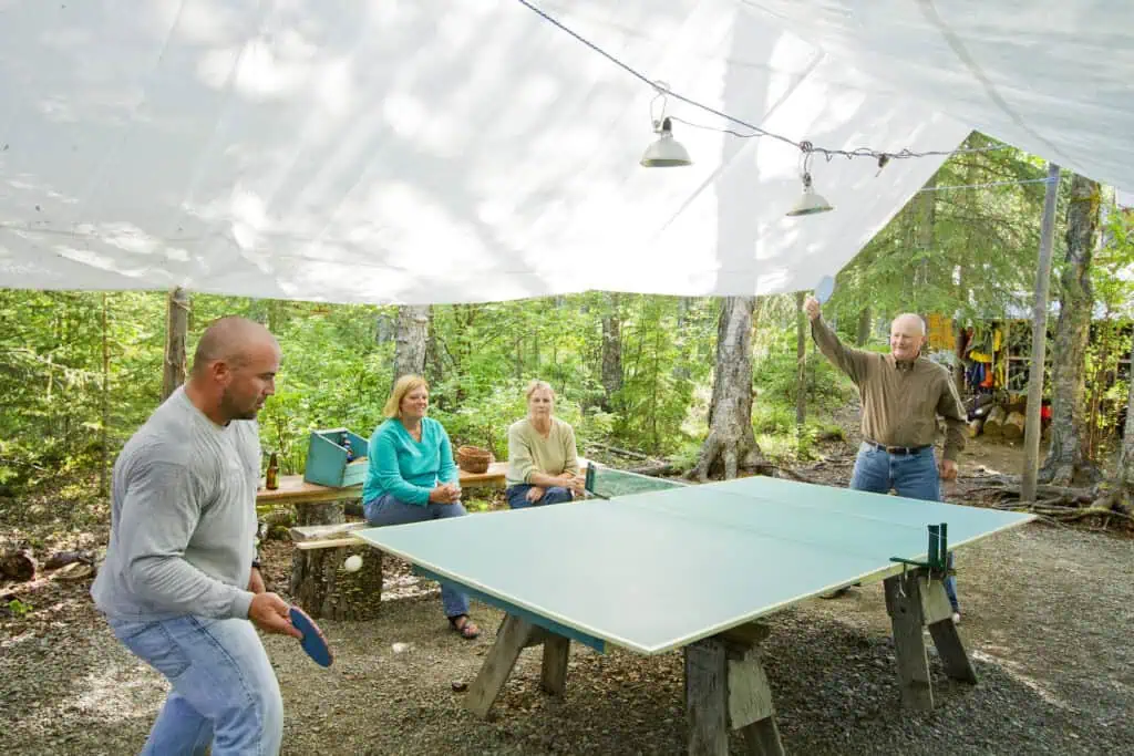 Family bonding via outdoors ping pong on the Ultimate Alaska Adventure