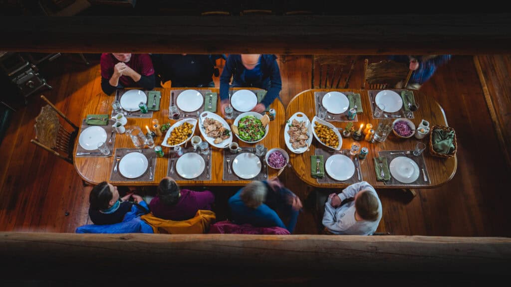 Guests at Kenai Backcountry Lodge enjoy a wilderness fine dining dinner experience