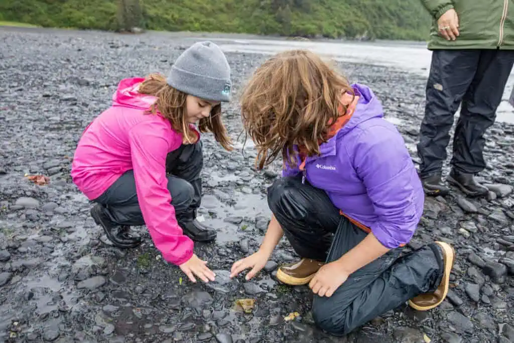 Two young visitors to Kenai Fjords Glacier Lodge explore near Aialik Bay