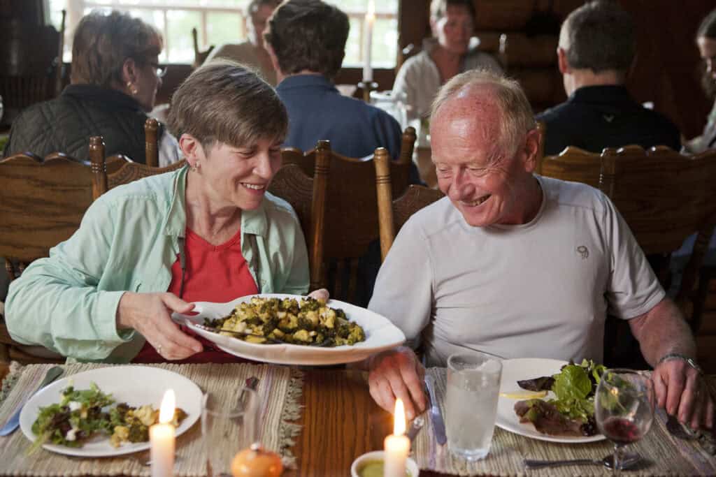 Dishes are passed around at Kenai Backcountry Lodge as part of the family-style wilderness fine dining experience